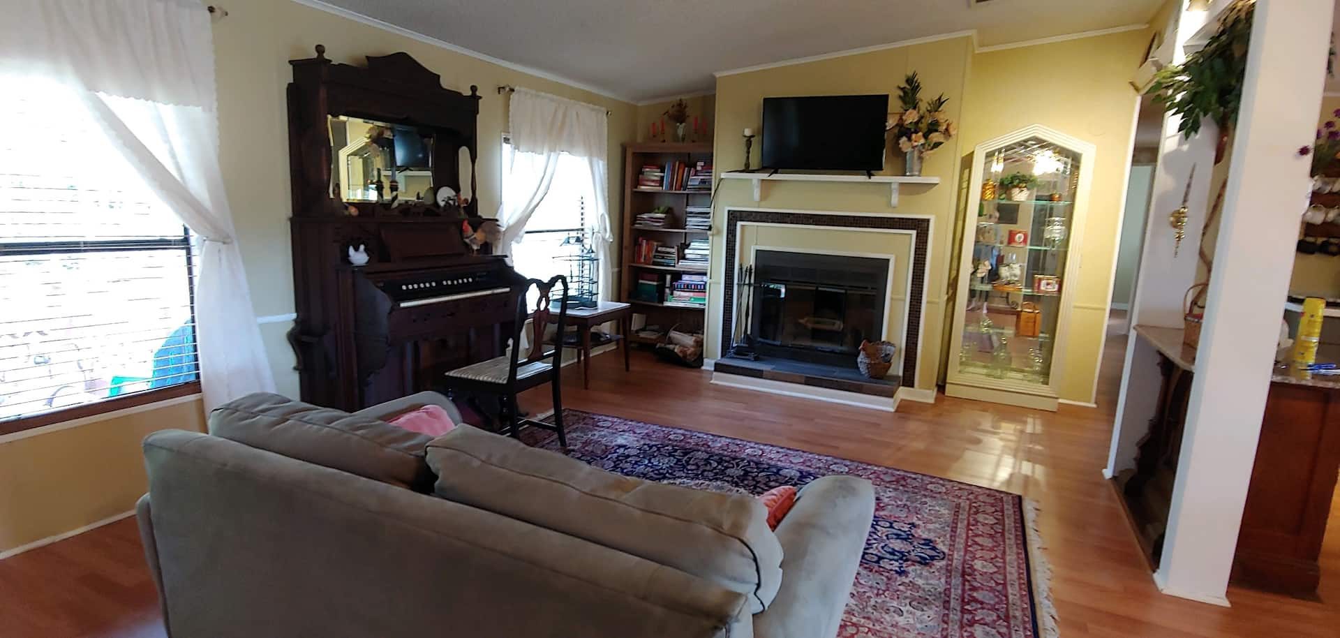 Living room with wood-burning fireplace
